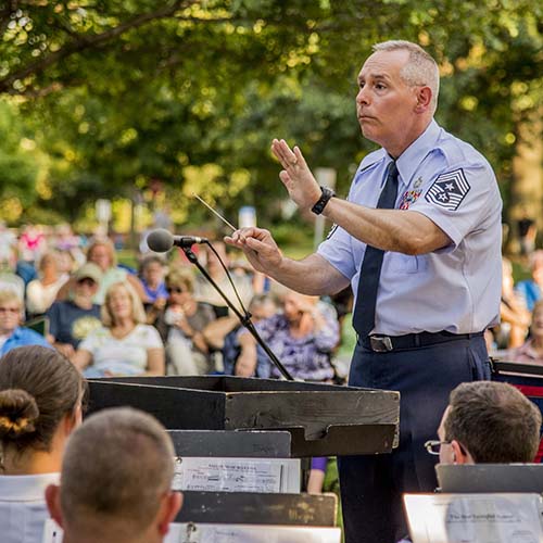 Chief Master Sergeant Phillip Smith leads the 122nd Army Band in the performance of Washington Post in Worthington, Ohio, in August, 2015